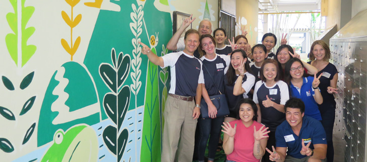 Volunteers from SPO and SSA-YEP pictured beside their colourful murals.