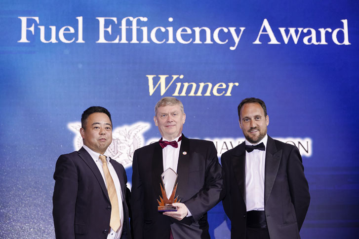 Simon Bennett (centre), CNCo's General Manager, Sustainable Development, received the award from Tetsuya Hayashi (left), Regional Manager of Southeast Asia and Oceania, Class NK, and Grant Elrick, Global Sales Director &ndash; Seatrade, UBM.