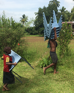 New classroom furniture delivered to a remote village in the Sepik River region.