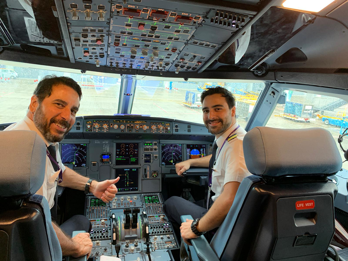 Captain Wilson (left) and his son Rodrigo working together on the same flight-deck.