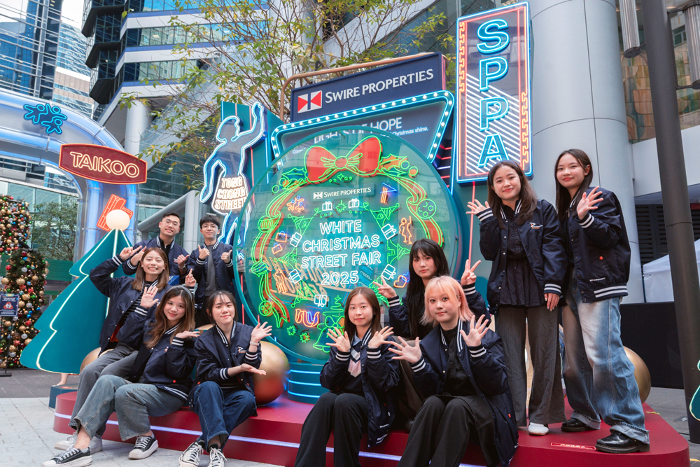 Local university students from the Swire Properties Placemaking Academy (SPPA) pose next to an installation they designed and created for the 2025 Street Fair.