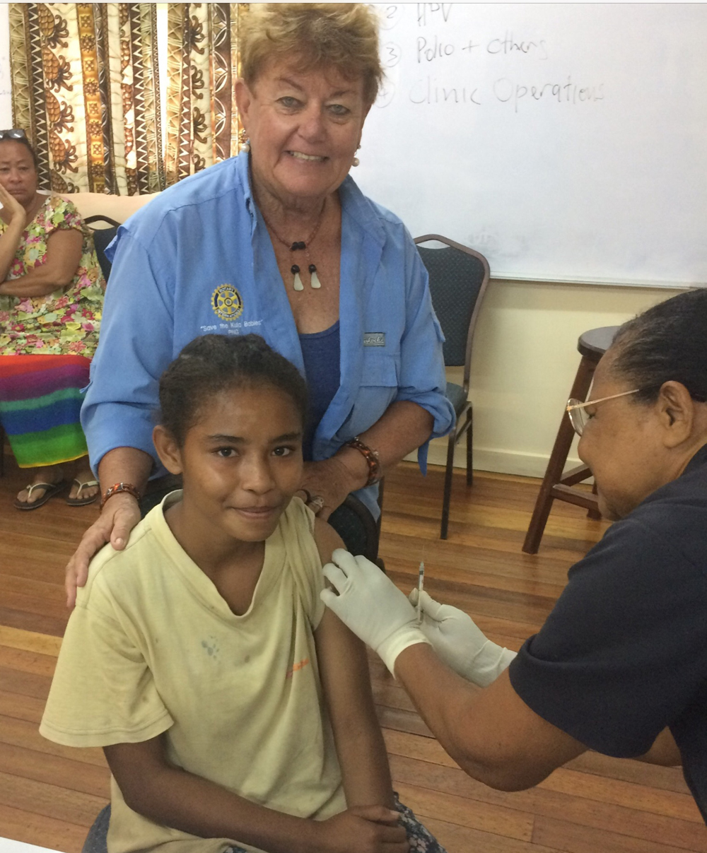 A young girl receives the HPV vaccination.