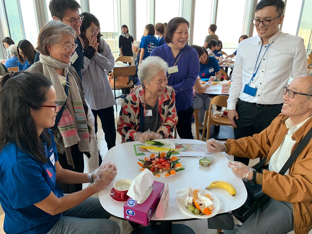 Swire Properties' Community Ambassadors take part in an elderly care programme.
