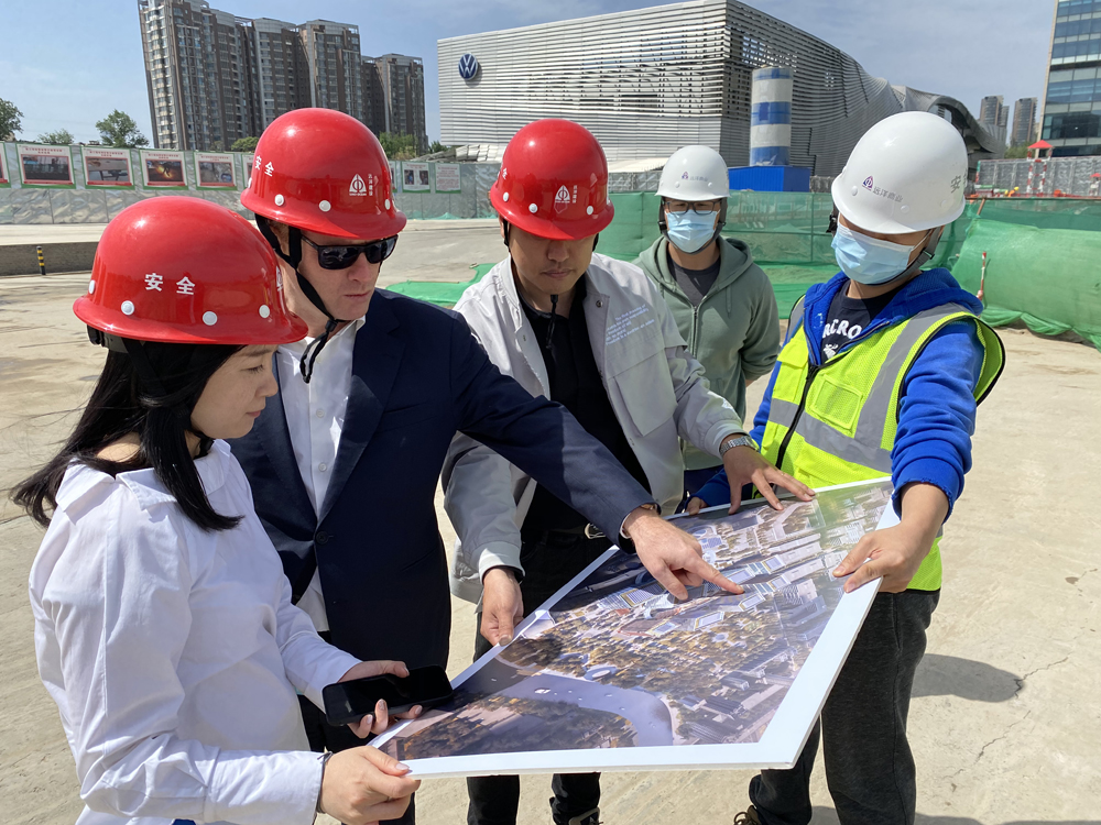 Merlin Swire (second from left), visits the construction site for Phase Two of Indigo in Beijing.