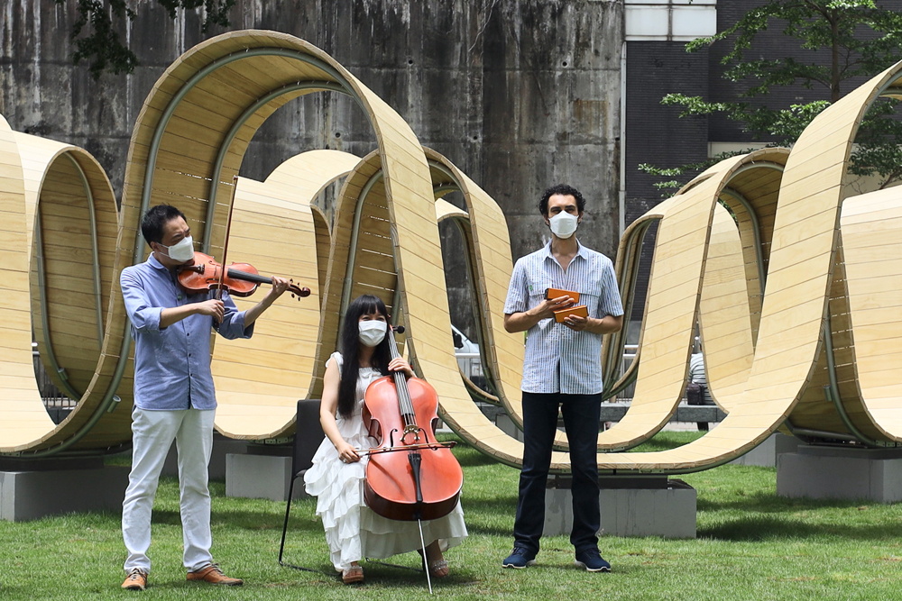 HK Phil musicians performing the 1.5°C theme song at Taikoo Park, Quarry Bay.
