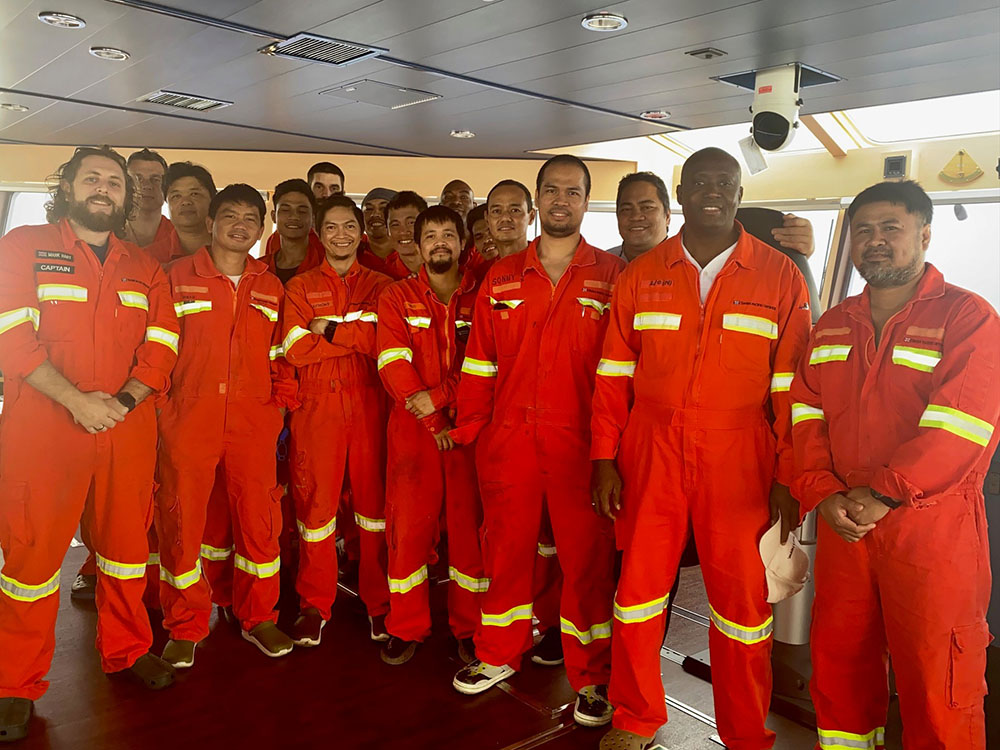 Captain Mark Hart (left) and his team on board Pacific-Guillemot.