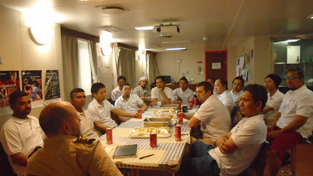 Ship&rsquo;s personnel on Eriskay share snacks and discuss the importance of looking after their mental health.