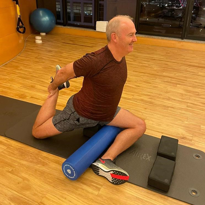 Enjoying yoga in his spare time.