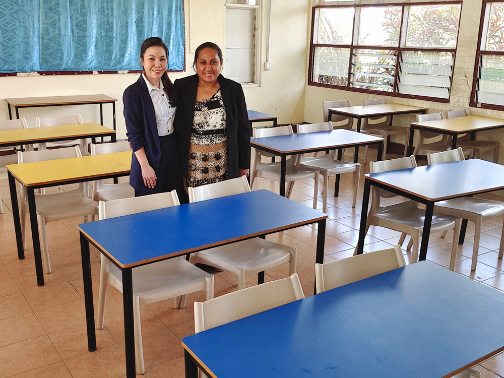 Christina Heng, Country Manager Tonga, Swire Shipping (left), presenting the donated school furniture to Mrs Maletina Hiliate, Principal of ‘Ahopanilolo Technical Institute.