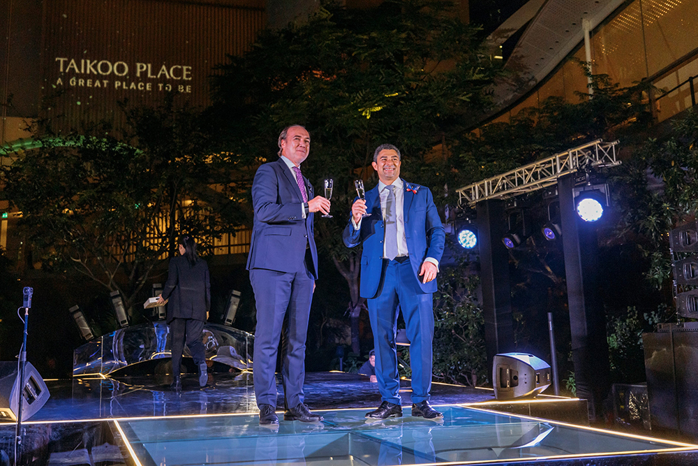 Swire Properties Chief Executive Tim Blackburn (left), and Director, Office, Don Taylor, toast the completion of the Taikoo Place Redevelopment Project.