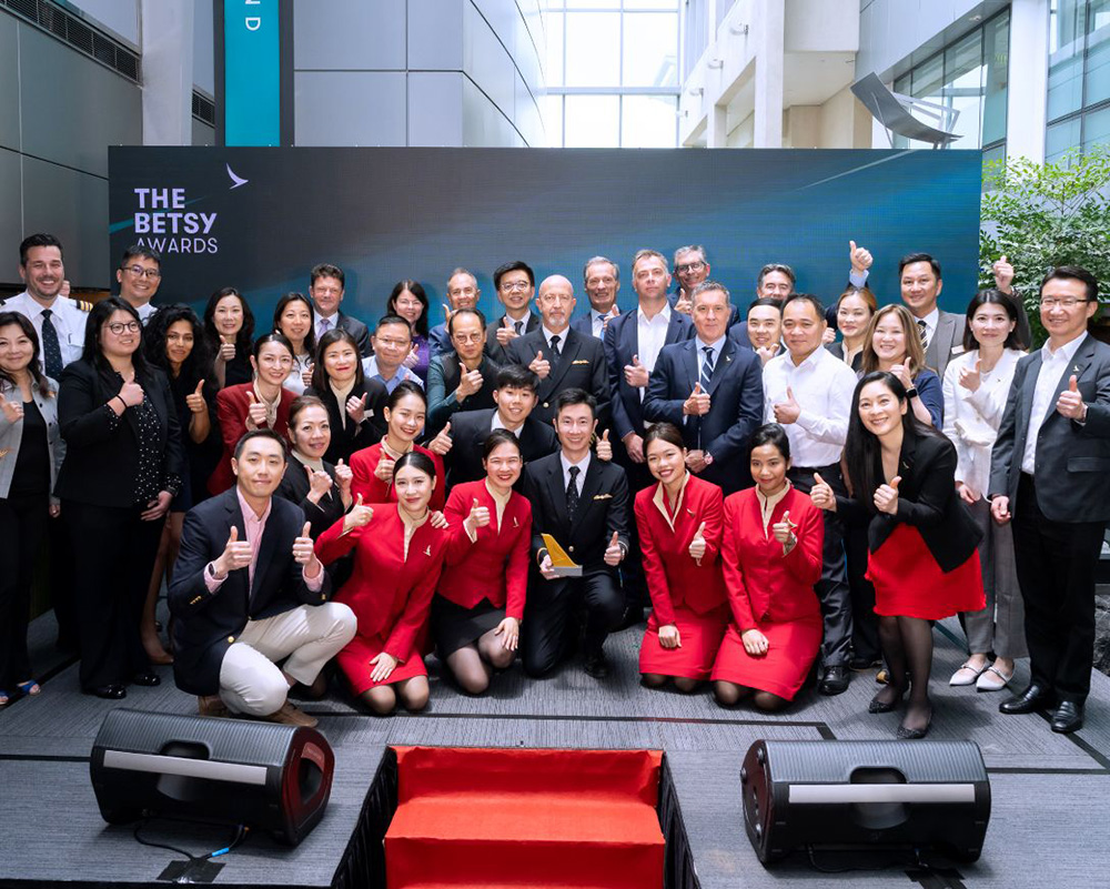The cross-departmental team receiving the Grand Award. 
