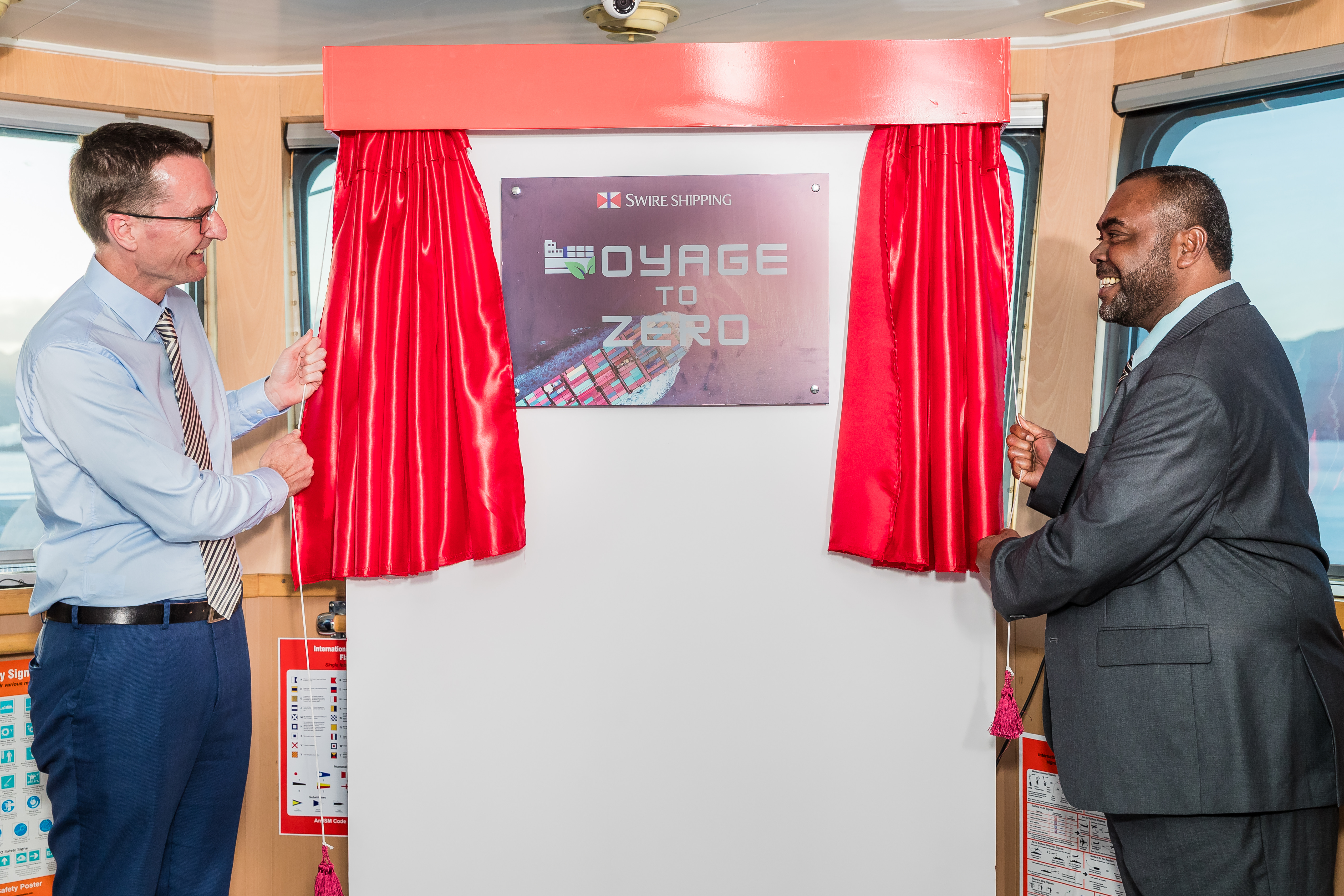 Swire Shipping Chief Executive Officer, Jeremy Sutton (left), and Hon. Mosese Bulitavu, Fiji’s Minister for Environment and Climate Change, unveil the “Voyage to Zero” programme. 