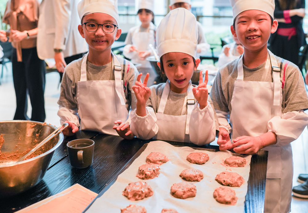 Students enjoy a cookie baking class at EAST Hong Kong hotel.