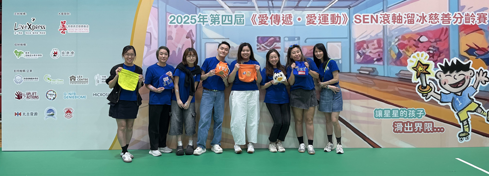 Members of the volunteer team show off upcycled, personalised pouch bags.
