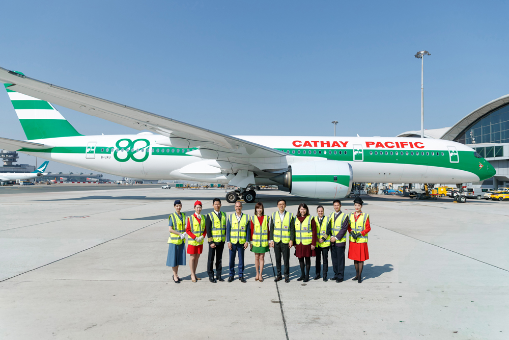 Cathay group Chief Executive Officer Ronald Lam (fifth from right), Chief Customer and Commercial Officer Lavinia Lau (fifth from left), Chief Operations and Service Delivery Officer Alex McGowan (fourth from left), and Chief Financial Officer Rebecca Sharpe (fourth from right) kick off the celebrations at Hong Kong International Airport.