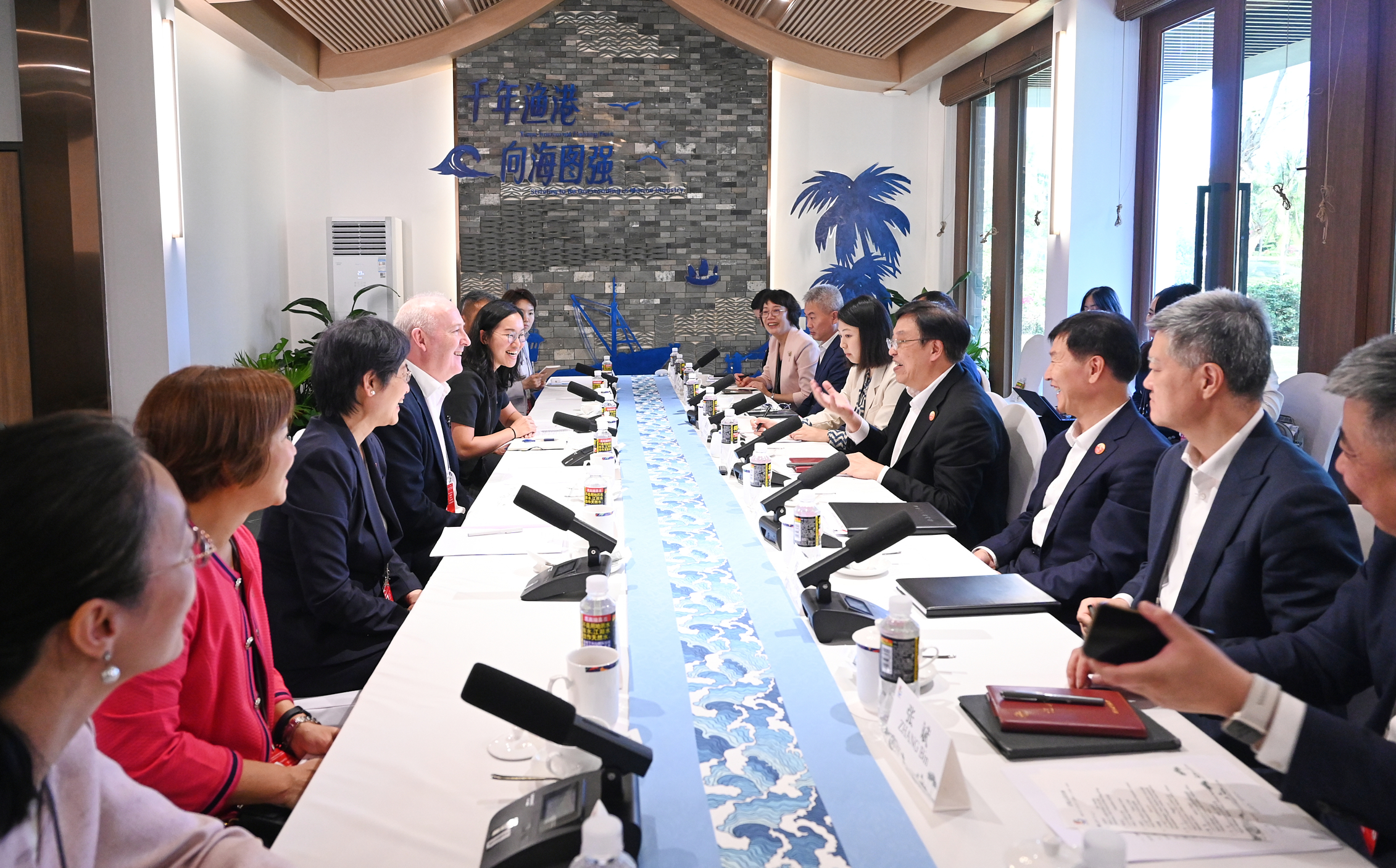Chairman Guy Bradley (left-hand side, fourth from left) attends a meeting with dignitaries in Hainan.